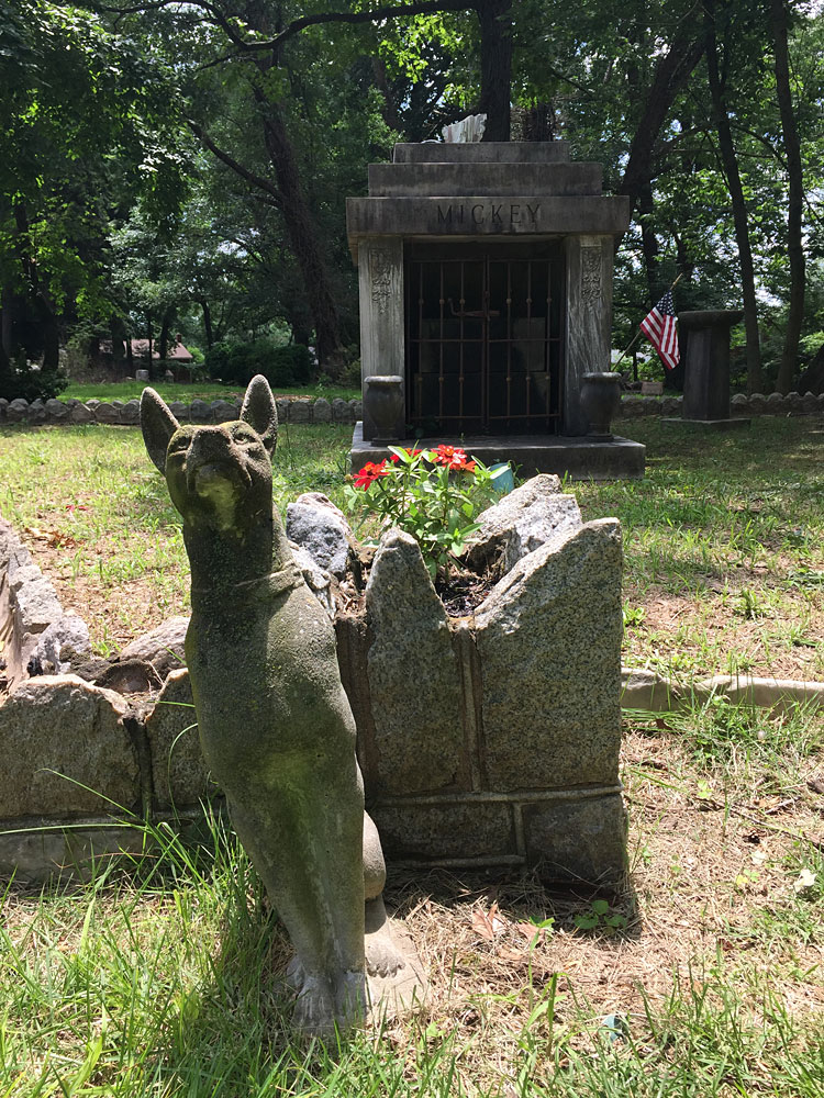 Dog guarding Mickey's Mausoleum (July 2018) dog statues