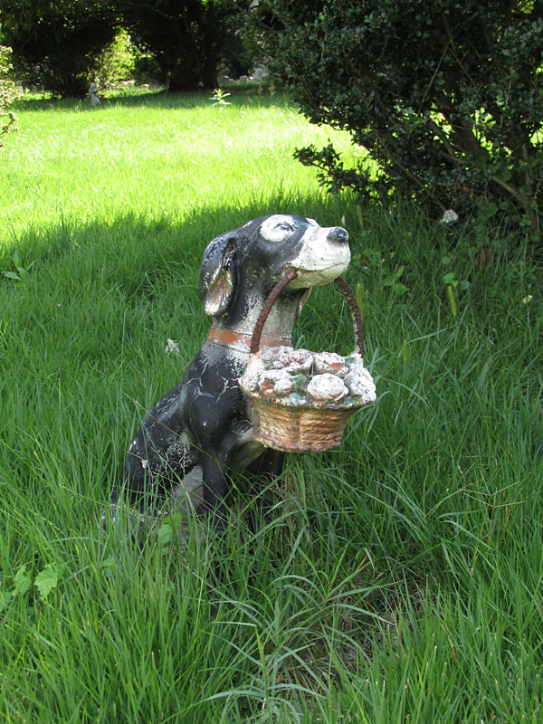 Dog statue with basket of flowers. (September 2014)